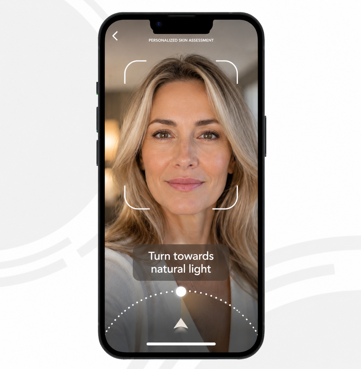 Personalized skin assessment shown on a phone, with a face framed in the camera guide