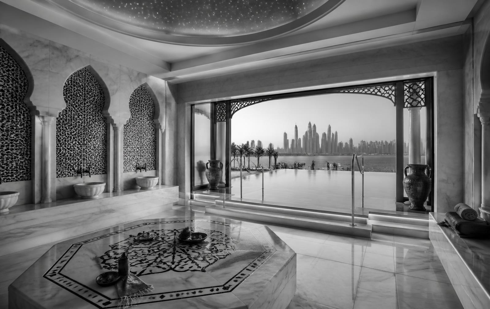 Black-and-white photograph of Talise Spa at Burj Al Arab in Dubai, marble hammam with infinity pool and skyline view