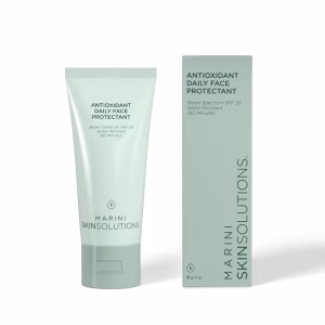 A light green tube and matching box of Jm Antioxidant Daily Face Protectant Broad Spectrum SPF 33, both standing upright on a white background.