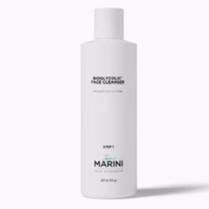 A white bottle of Jan Marini Bio Glycolic Face Cleanser with a white cap, displaying black and teal text and marked as Step 1 in a skincare regimen.