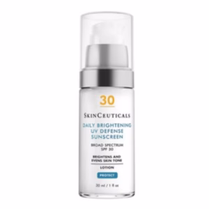 A clear pump bottle of Skinceuticals Daily Brightening UV Defense Sunscreen SPF 30 with white and blue text on a white label and a transparent cap.