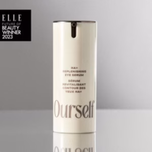 A bottle of Ourself ha+ replenishing eye serum stands on a light surface, with an "ELLE Future of Beauty Winner 2023" badge displayed in the top left corner.