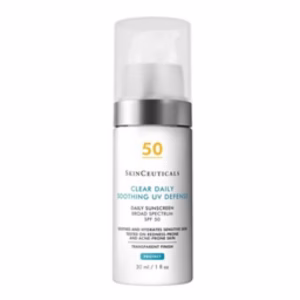 A 30 mL bottle of Skinceuticals Clear Daily Soothing UV Defense SPF 50 features a white and silver pump design and is labeled for sensitive, acne-prone skin.