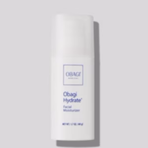 A white bottle of Obagi Hydrate with a pump dispenser stands upright against a light gray background. The blue label displays the product and brand name.