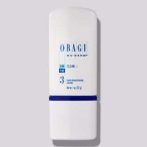 A white bottle of Obagi Clear Fx with blue text and numbering stands upright on a light gray background.