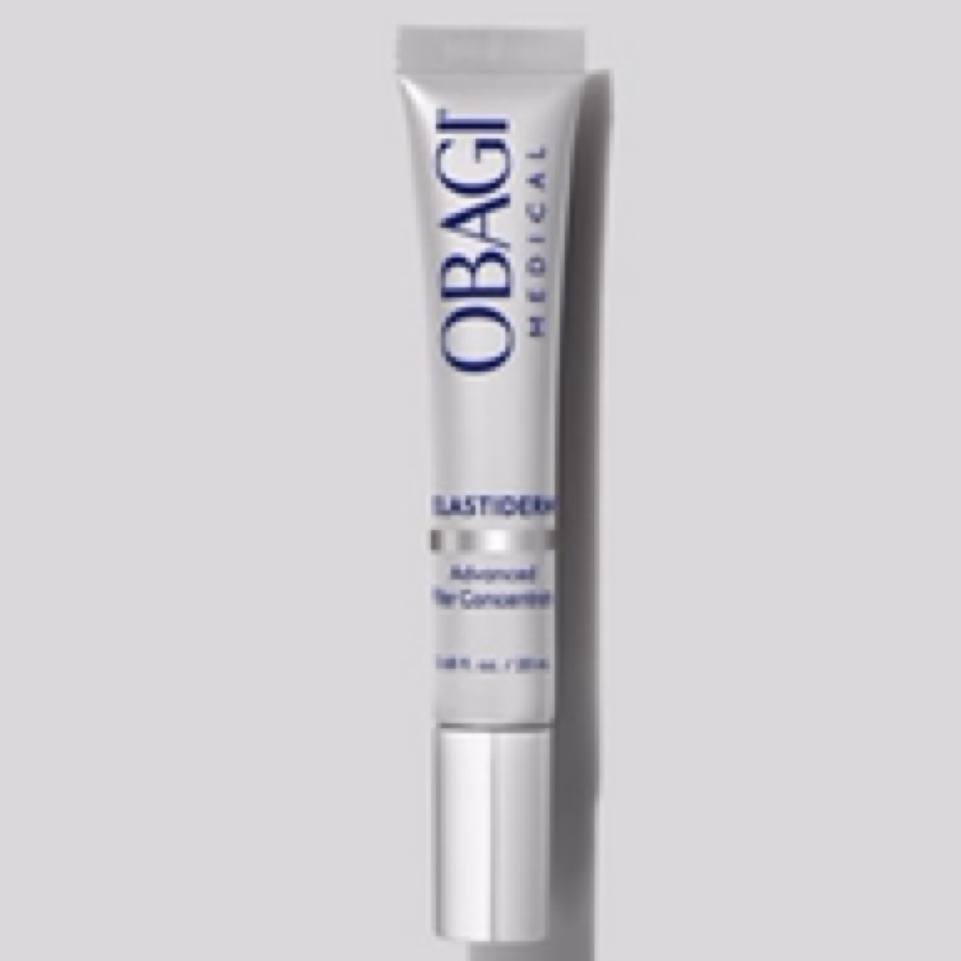 A silver tube of Obagi advanced filler concentrate, labeled “Advanced Filler Concentrate,” stands upright against a light gray background.