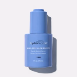 A blue bottle of Hydropeptide Microdose Glow Booster with a pump dispenser is displayed against a plain white background.