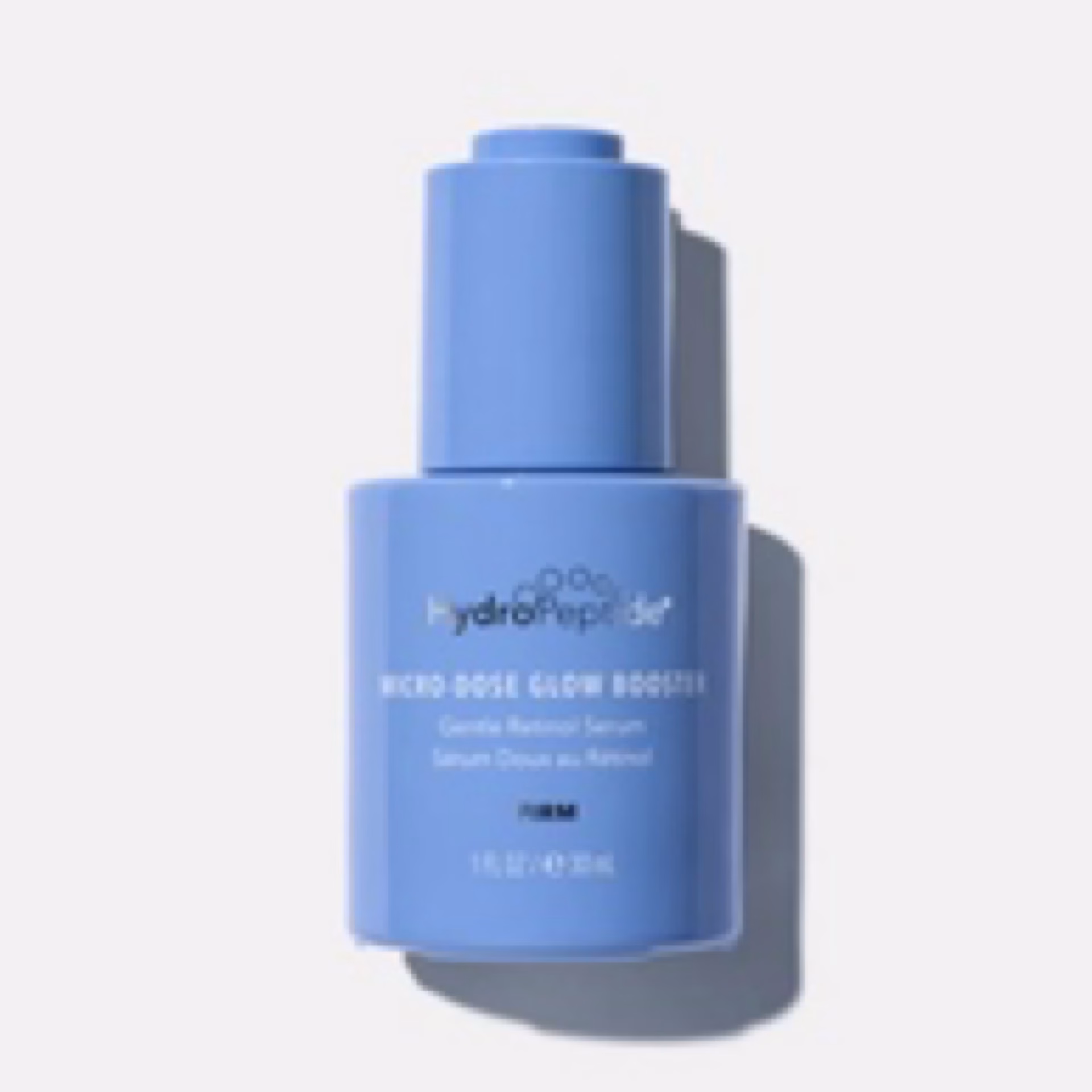 A blue bottle of Hydropeptide Microdose Glow Booster with a pump dispenser is displayed against a plain white background.